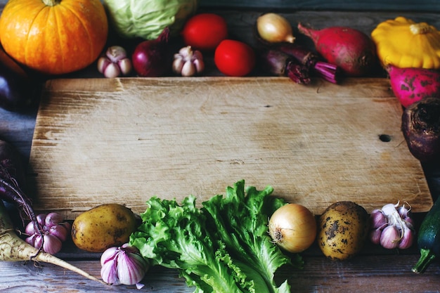 Seasonal vegetables on wooden board